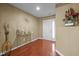 Welcoming foyer with hardwood floors, elegant decor, and plenty of natural light at 1533 Brown Owl Dr, Raleigh, NC 27610