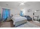 Bedroom with a large bed, sitting area, and lots of light at 1533 Brown Owl Dr, Raleigh, NC 27610