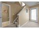 Hallway with stairs, a neutral color scheme, and a white door at 1533 Brown Owl Dr, Raleigh, NC 27610