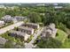Serene aerial shot showcasing a townhouse community surrounded by lush trees and greenery at 1601 Bowery Dr, Raleigh, NC 27607