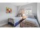 Inviting bedroom with twin beds, colorful artwork, and plenty of natural light at 1601 Bowery Dr, Raleigh, NC 27607