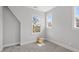 Neutral bedroom featuring ample natural light and a cozy woven basket at 1601 Bowery Dr, Raleigh, NC 27607