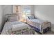 Charming bedroom featuring twin beds, natural light, and colorful decor for a cozy and inviting space at 1601 Bowery Dr, Raleigh, NC 27607