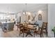 Open-concept dining area with modern lighting and seamless access to the kitchen at 1601 Bowery Dr, Raleigh, NC 27607