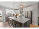 Modern kitchen with stainless steel appliances and a large center island with seating at 1601 Bowery Dr, Raleigh, NC 27607