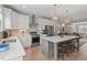 Stylish kitchen featuring white cabinets, stainless steel appliances, and a spacious island at 1601 Bowery Dr, Raleigh, NC 27607
