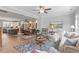 Open-concept living space with hardwood floors, dining area, and a glimpse of the modern kitchen at 1601 Bowery Dr, Raleigh, NC 27607