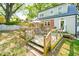 Backyard featuring a spacious wooden deck, ideal for outdoor dining and relaxation at 1617 Woodland Ave, Burlington, NC 27215
