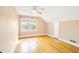 Bedroom with hardwood floors, a ceiling fan, and natural light, providing a bright and comfortable atmosphere at 1617 Woodland Ave, Burlington, NC 27215