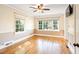 Bedroom featuring hardwood floors, trim detailing, ceiling fan, natural light and neutral paint at 1617 Woodland Ave, Burlington, NC 27215