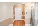 Inviting entryway showcasing hardwood floors and classic archway details at 1617 Woodland Ave, Burlington, NC 27215