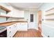 Charming kitchen with white cabinets, butcher block countertops, stainless appliances, and chalkboard at 1617 Woodland Ave, Burlington, NC 27215