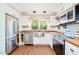 Bright kitchen featuring stainless steel appliances, wooden countertops, and natural light at 1617 Woodland Ave, Burlington, NC 27215