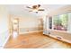 Hardwood floors, natural light, and an arched doorway in this spacious, well-lit living area at 1617 Woodland Ave, Burlington, NC 27215
