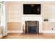 Cozy fireplace with decorative mantel and built-in shelving in the well-lit living room at 1617 Woodland Ave, Burlington, NC 27215