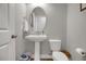 Cozy powder room features pedestal sink, oval mirror, and neutral paint at 171 School Side Dr, Spring Lake, NC 28390