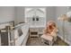 Close up view of a Bedroom featuring a teddy bear, rocking chair, and window at 171 School Side Dr, Spring Lake, NC 28390