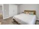 Neutral bedroom featuring a queen size bed with white bedding and bedside tables at 171 School Side Dr, Spring Lake, NC 28390