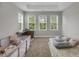 Comfortable bedroom with natural light, workspace, crib, and daybed at 171 School Side Dr, Spring Lake, NC 28390