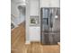 Bright kitchen with stainless appliances, adjacent to staircase, and ample storage at 171 School Side Dr, Spring Lake, NC 28390
