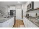 Well-appointed kitchen featuring stainless steel appliances and sleek granite counters at 171 School Side Dr, Spring Lake, NC 28390