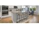 Kitchen boasts island with granite countertops and bar seating, and stainless appliances at 171 School Side Dr, Spring Lake, NC 28390