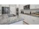 Modern kitchen featuring granite countertops, stainless steel appliances, and white cabinetry at 171 School Side Dr, Spring Lake, NC 28390