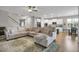 Spacious living room open to kitchen and dining with plenty of natural light at 171 School Side Dr, Spring Lake, NC 28390