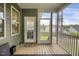 Cozy screened porch with wooden floors offering a relaxing outdoor space at 171 School Side Dr, Spring Lake, NC 28390