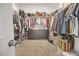 Spacious walk-in closet with shelving and ample storage space for clothing at 171 School Side Dr, Spring Lake, NC 28390
