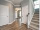 Inviting foyer featuring hardwood floors, a staircase, and access to various rooms at 2006 Cross Bones Blvd # 34, Durham, NC 27703