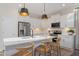 Modern kitchen with white cabinets, stainless steel appliances, and a breakfast bar with seating at 2006 Cross Bones Blvd # 34, Durham, NC 27703