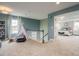 Versatile upstairs landing area with a play teepee, neutral carpet, and an open view to the main bedroom at 2006 Cross Bones Blvd # 34, Durham, NC 27703