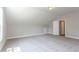 Open concept bonus room featuring neutral paint, a carpeted floor, with a white door leading into the hallway at 205 Riverine Dr, Pittsboro, NC 27312