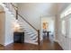 Spacious foyer showcasing hardwood floors, staircase and an adjacent office at 205 Riverine Dr, Pittsboro, NC 27312
