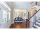 Welcoming foyer with hardwood floors leading to an elegant dining room at 205 Riverine Dr, Pittsboro, NC 27312