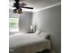 Comfortable bedroom with natural light, ceiling fan, and simple decor at 206 Arbor Dr, Elon, NC 27244