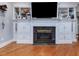 Living room features a fireplace with built in shelves and cabinets at 206 Arbor Dr, Elon, NC 27244