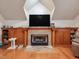 Living room with fireplace, built in shelving and hardwood floors at 206 Arbor Dr, Elon, NC 27244