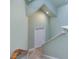 Bright staircase with hardwood railings and neutral colored walls at 206 Arbor Dr, Elon, NC 27244