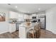 Modern kitchen featuring white cabinets, stainless steel appliances, and a center island at 21 Artesa Ct, Fuquay Varina, NC 27526