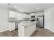 Modern kitchen with stainless steel appliances, granite countertops, and a center island at 21 Artesa Ct, Fuquay Varina, NC 27526