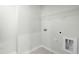 Efficient laundry room space with tile flooring and essential hookups at 21 Artesa Ct, Fuquay Varina, NC 27526