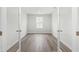 Empty office space with neutral walls, wood floors and one window for natural light at 21 Artesa Ct, Fuquay Varina, NC 27526