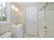This bathroom has updated fixtures, a tub and shower combo, and a marble-tiled floor at 2108 Quail View Trail, Raleigh, NC 27604
