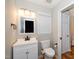 Well-lit bathroom with a white vanity, black hardware, and matching framed mirror at 2108 Quail View Trail, Raleigh, NC 27604