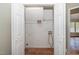 Spacious walk-in closet with white shelving and hardwood-style flooring, providing ample storage at 2108 Quail View Trail, Raleigh, NC 27604