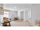 Upstairs loft featuring a seating area, desk, and bright natural light, creating an inviting multi-purpose space at 2140 Monk Dr, Haw River, NC 27258