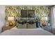Nicely decorated bedroom with leaf-patterned wall, pillows and contemporary art pieces at 2156 Monk Dr, Haw River, NC 27258