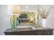 Interior view of dresser in bedroom showcasing home decor accents and a decorative lamp at 2156 Monk Dr, Haw River, NC 27258